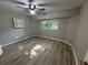 This bedroom has a window, closet and ceiling fan at 726 Chevy Chase St, Port Charlotte, FL 33948