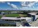 Aerial image of the community's baseball park offering a stadium and green fields under a cloudy sky at 7280 Muncey Rd, North Port, FL 34291