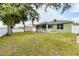 A spacious backyard features a screened porch, shed, and a well-maintained lawn at 7280 Muncey Rd, North Port, FL 34291