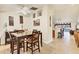 Cozy dining room featuring tile floors, a ceiling fan, and seating for four around a dark wood table at 7280 Muncey Rd, North Port, FL 34291
