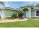 Charming house featuring manicured lawn, and lush landscaping, enhancing its curb appeal at 7280 Muncey Rd, North Port, FL 34291