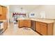 Bright kitchen featuring tile floors, stainless steel appliances, and ample cabinet space at 7280 Muncey Rd, North Port, FL 34291