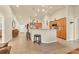 Open concept home featuring tile floors, a kitchen island with bar seating, and a large living area at 7280 Muncey Rd, North Port, FL 34291