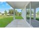 Back porch with view of lawn and sunny sky at 7345 Ellis Ln, Port Charlotte, FL 33981
