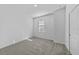 Bedroom with window, carpet, and closet at 7345 Ellis Ln, Port Charlotte, FL 33981