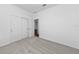 Spacious bedroom with gray carpet and closet with double doors at 7345 Ellis Ln, Port Charlotte, FL 33981