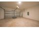 Clean and empty two-car garage with functional garage door and high ceilings at 7345 Ellis Ln, Port Charlotte, FL 33981