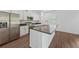 Bright kitchen featuring stainless steel appliances, granite countertops, and a large island with seating at 7345 Ellis Ln, Port Charlotte, FL 33981