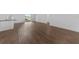 Bright living room featuring wood-look flooring and sliding glass doors to the outside at 7345 Ellis Ln, Port Charlotte, FL 33981