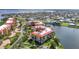Aerial view of condos near the water, with easy access to local streets and residential homes at 90 Vivante Blvd # 202, Punta Gorda, FL 33950