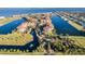 Breathtaking aerial view of the community, showcasing waterways, condos, and manicured landscaping at 90 Vivante Blvd # 202, Punta Gorda, FL 33950