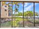 Screened-in balcony with palm tree views at 90 Vivante Blvd # 202, Punta Gorda, FL 33950