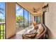 The screened lanai is the perfect place to relax with views of the water and tropical landscaping at 90 Vivante Blvd # 202, Punta Gorda, FL 33950