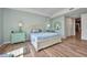 Bright bedroom featuring a comfortable bed, modern TV, and plenty of closet space, offering a relaxing retreat at 90 Vivante Blvd # 202, Punta Gorda, FL 33950