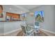 Bright dining nook adjacent to the kitchen with a view to the outside from the large windows at 90 Vivante Blvd # 202, Punta Gorda, FL 33950