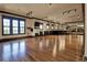 Bright fitness studio with hardwood floors, large mirrors, and multiple windows at 90 Vivante Blvd # 202, Punta Gorda, FL 33950