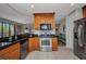 Modern kitchen boasts stainless steel appliances, granite countertops, and an open design at 90 Vivante Blvd # 202, Punta Gorda, FL 33950