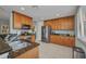 Well-lit kitchen boasts stainless steel appliances, granite countertops, and ample wood cabinetry at 90 Vivante Blvd # 202, Punta Gorda, FL 33950