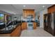 Modern kitchen features stainless steel appliances, granite countertops, and a breakfast bar at 90 Vivante Blvd # 202, Punta Gorda, FL 33950