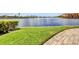 Scenic waterfront community with lush green lawns, providing a tranquil and picturesque setting for relaxation and recreation at 90 Vivante Blvd # 202, Punta Gorda, FL 33950