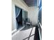 Private balcony with seating, offering an inviting outdoor space for relaxation and enjoying the surroundings at 93 Boundary Blvd # 303, Rotonda West, FL 33947
