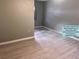 Bedroom featuring hard surface floors, light paint, and a bright window at 93 Boundary Blvd # 303, Rotonda West, FL 33947