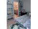 Inviting bedroom featuring a blue floral bedspread and bamboo shelving, creating a serene coastal retreat at 93 Boundary Blvd # 303, Rotonda West, FL 33947