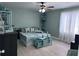 Bright bedroom with ample natural light, showcasing a neatly arranged bed and decorative corner shelves at 93 Boundary Blvd # 303, Rotonda West, FL 33947