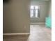 Spacious bedroom featuring hard surface floors, light paint, and a bright window at 93 Boundary Blvd # 303, Rotonda West, FL 33947