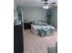 The bedroom has a bed, and decor, with a calming color scheme at 93 Boundary Blvd # 303, Rotonda West, FL 33947