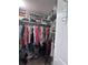 Interior walk-in closet featuring built in shelves and hanging racks at 93 Boundary Blvd # 303, Rotonda West, FL 33947