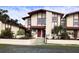 Charming two-story townhome with well-maintained landscaping and neutral exterior at 93 Boundary Blvd # 303, Rotonda West, FL 33947