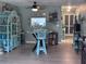 A living room with hardwood floors and a view into another room at 93 Boundary Blvd # 303, Rotonda West, FL 33947