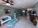 Large living room features tile floors, high ceilings, comfortable seating and tasteful decor at 93 Boundary Blvd # 303, Rotonda West, FL 33947