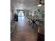 Inviting open-concept living space, featuring tiled floors, natural light, and patio views at 93 Boundary Blvd # 303, Rotonda West, FL 33947