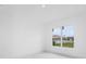 Bright room with large window providing natural light and views of the outdoors at 165 Ingram Blvd, Rotonda West, FL 33947
