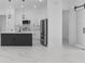 Well-lit modern kitchen with an island, stainless steel appliances, and sleek cabinetry at 165 Ingram Blvd, Rotonda West, FL 33947