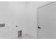 A clean, minimalist laundry room with modern fixtures, perfect for any homeowner at 165 Ingram Blvd, Rotonda West, FL 33947