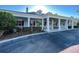 Front of the community center with a porch and ample parking at 1273 Jonah Dr, North Port, FL 34289