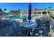 Inviting community pool area with lounge chairs and patio tables for relaxing poolside at 1273 Jonah Dr, North Port, FL 34289