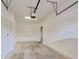Spacious garage with ample storage space and a door to the interior of the home at 1273 Jonah Dr, North Port, FL 34289