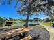 Scenic community area featuring a gazebo, lake, picnic table, and barbecue for outdoor enjoyment at 1273 Jonah Dr, North Port, FL 34289