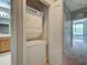 A laundry room including a stackable washer and dryer unit at 1273 Jonah Dr, North Port, FL 34289