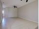 Spacious living room with tile flooring and neutral paint, creating a bright and open space at 1273 Jonah Dr, North Port, FL 34289