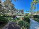 Community park with picnic tables, lush greenery, and paved walkways, perfect for outdoor gatherings at 1273 Jonah Dr, North Port, FL 34289