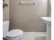 Neutral powder room with white toilet and pedestal sink at 1273 Jonah Dr, North Port, FL 34289