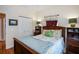 Inviting bedroom with traditional furnishings including a wooden headboard bed and coordinating side tables at 1318 Red Oak Ln, Port Charlotte, FL 33948