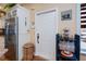 Interior shot highlighting the front entryway with a white door and adjacent kitchen featuring stainless steel appliances at 1318 Red Oak Ln, Port Charlotte, FL 33948