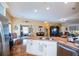 Spacious kitchen island with sink, offering views into the living area and stainless appliances at 1318 Red Oak Ln, Port Charlotte, FL 33948