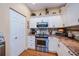 Well-equipped kitchen with stainless steel appliances, granite countertops, and ample cabinet space at 1318 Red Oak Ln, Port Charlotte, FL 33948